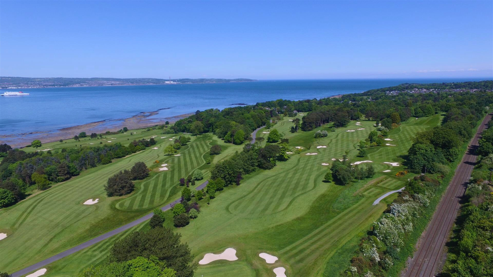 Sprawling greens at Royal Belfast Golf Club. The water in the background.